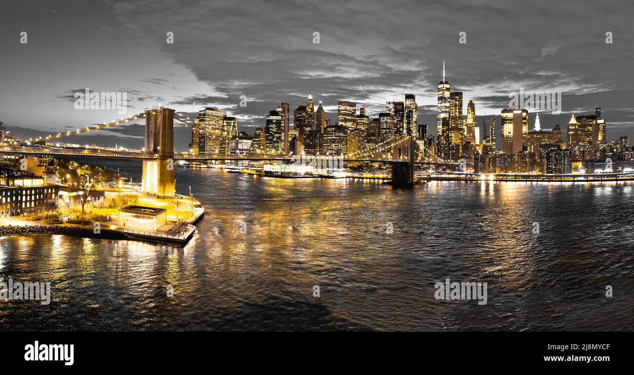 New York City golden lights on black and white background panoramic view, Brooklyn bridge, United states of America Stock Photo