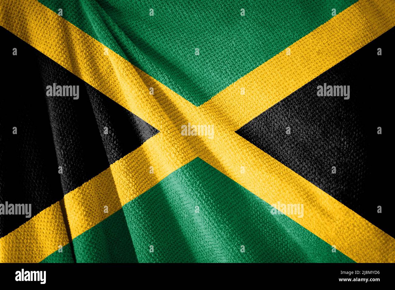 Jamaica flag on towel surface illustration with, country symbol Stock Photo