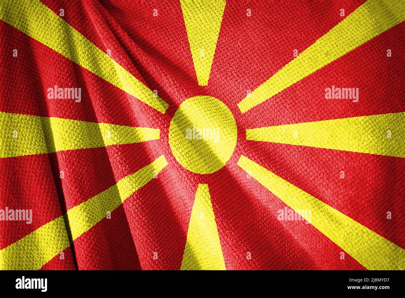 Northern Macedonia flag on towel surface illustration with, country symbol Stock Photo