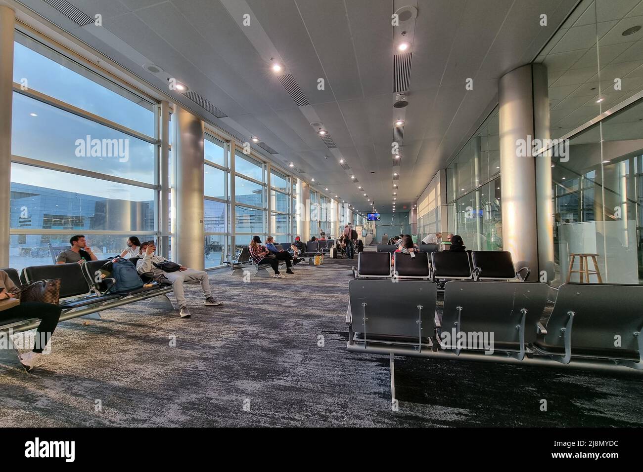 April 1 2022, Miami, Florida, USA - Miami international airport gate waiting area view. MIA. Miami airport is busy travel hub in Florida, United State Stock Photo