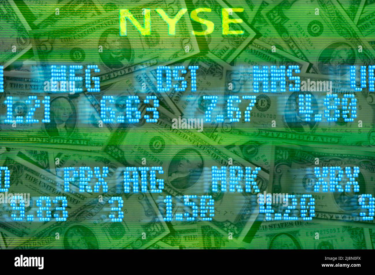 New York Stock Exchange stock trading board listings moving across US dollar bills. Investing in the stock market in the. USA. Stock Photo
