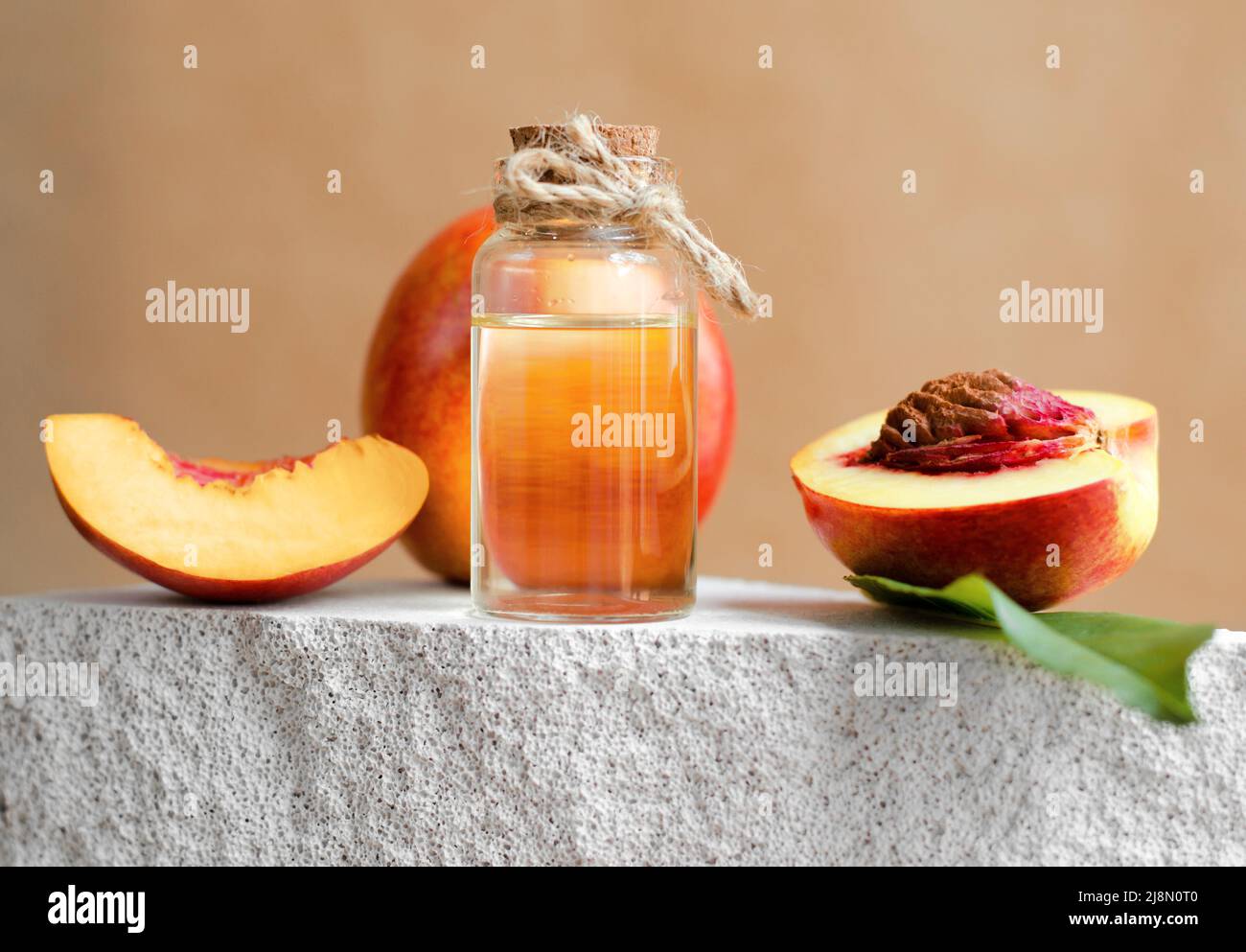 Peach essential oil bottle. Natural cosmetics for skin care. Serum