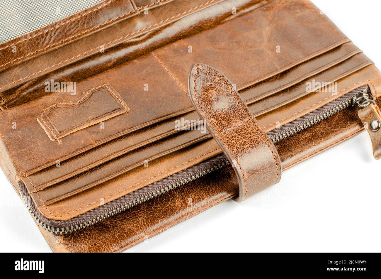 Open brown men's wallet on a white background close up Stock Photo