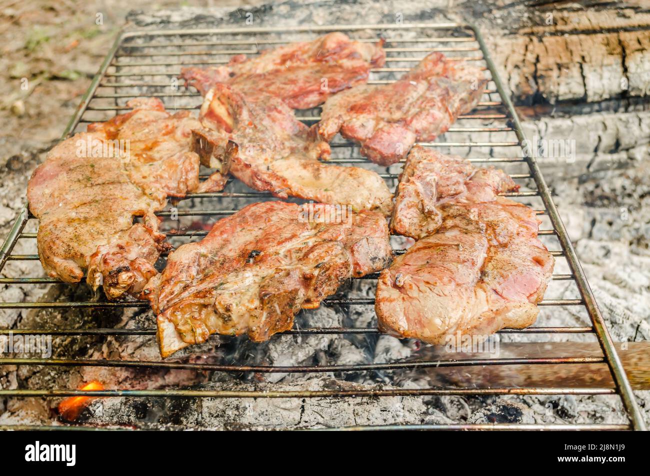 Meat for food pork tenderloin on a summer grill with a flame Stock Photo Alamy