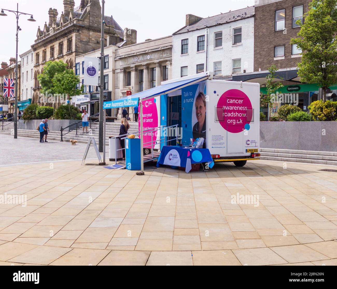 Cancer Awareness Roadshow vehicle in the town centre in Darlington,England,UK Stock Photo