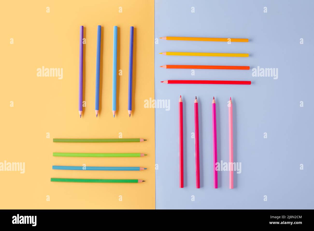 a few colored pencils on a yellow-blue background Develop creativity Get creative Stock Photo