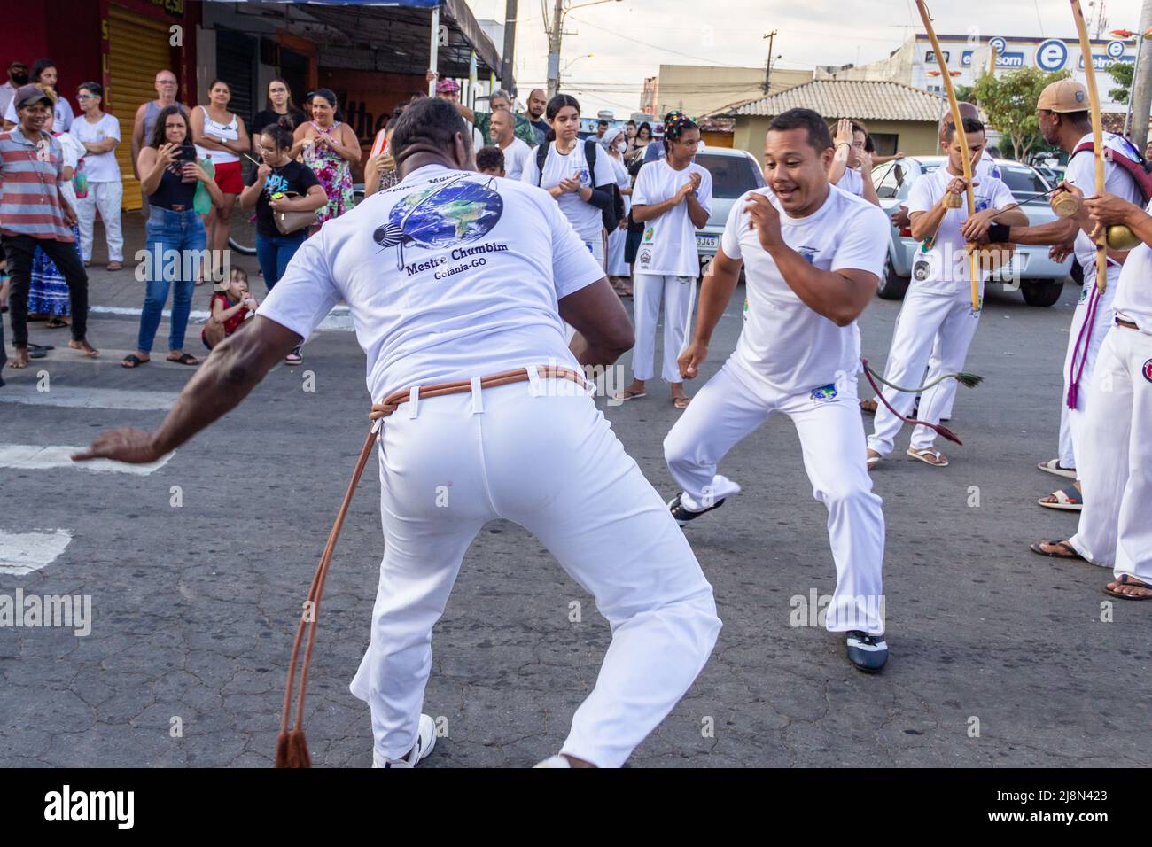 Aparecida de Goiania, Goiás, Brazil – May 15, 2022: A group of people demonstrating the capoeira fight in the Procession of Pretos Velhos. Stock Photo