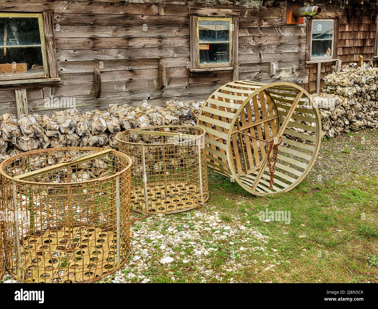 Wooden baskets used for oyster harvesting are stored behind a shed at an oyster farm near Willapa Bay in Washington. Stock Photo