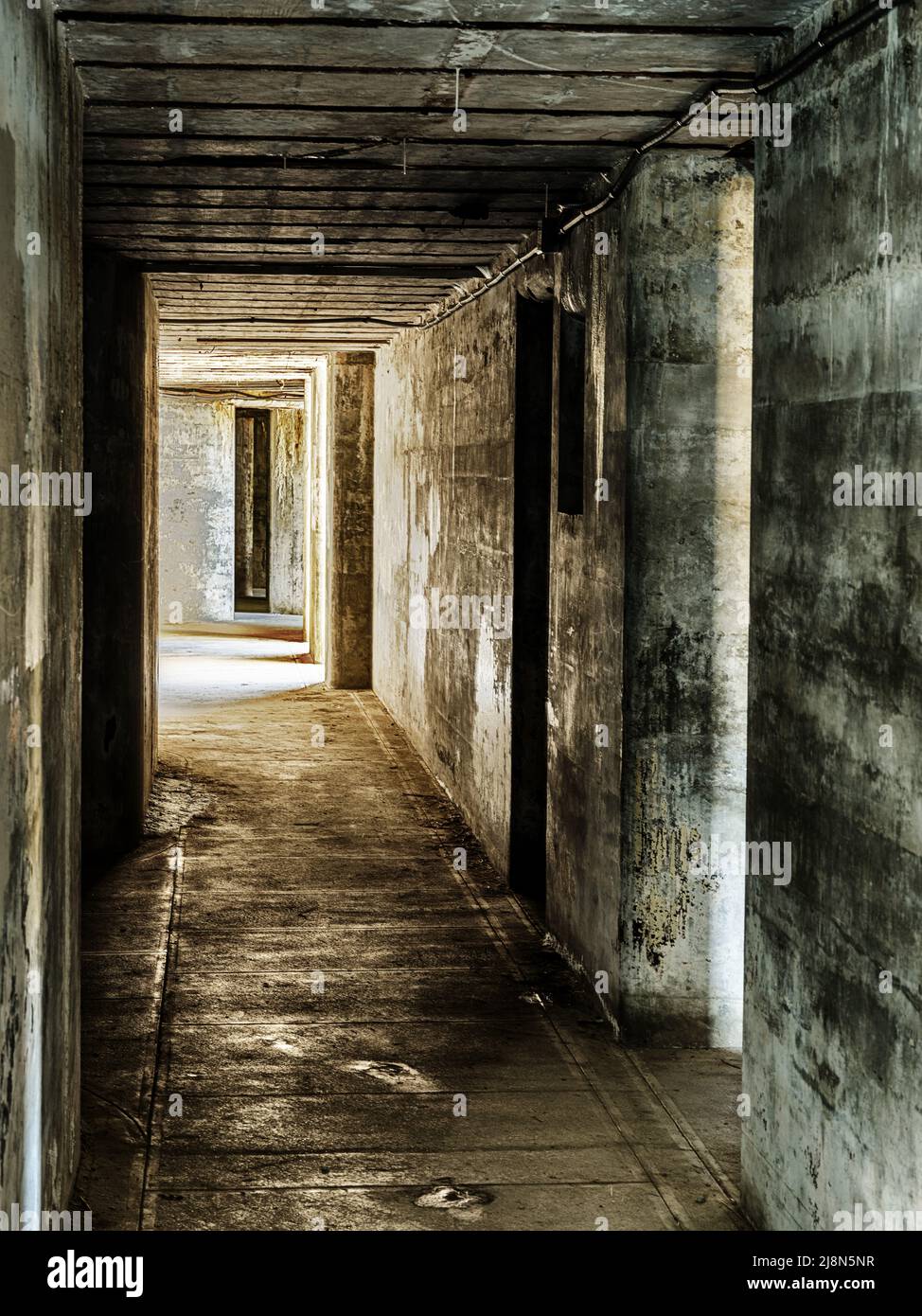 A long corridor with many doors runs through the basement levels of the Fort Casey landmark. Stock Photo