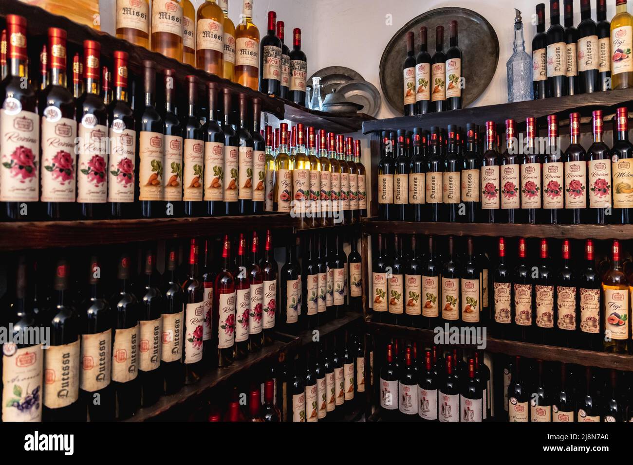 Shelves with fruit and rose wines in Queens Winery House in Palace