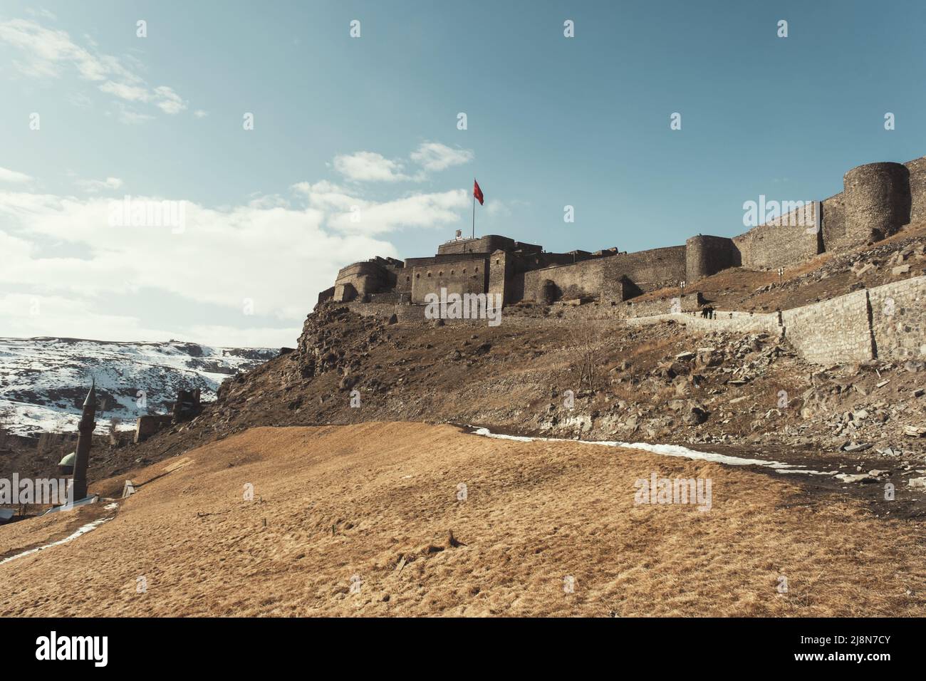 Kars, Turkey - February 23, 2022: Castle of Kars city in Turkey on a blue sky background. Stock Photo
