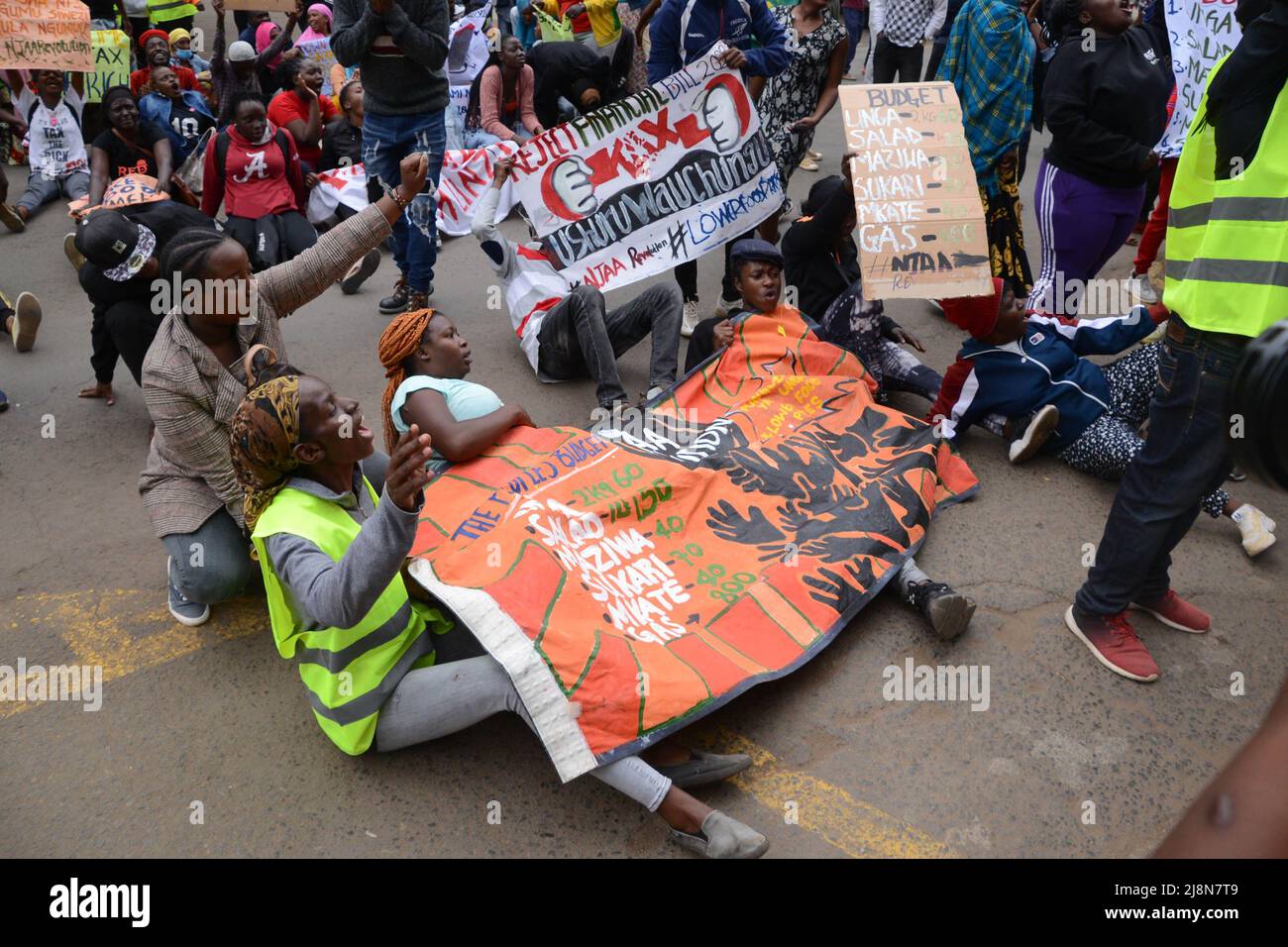 Nairobi, Kenya. 17th May, 2022. Protesters lay on the ground during the