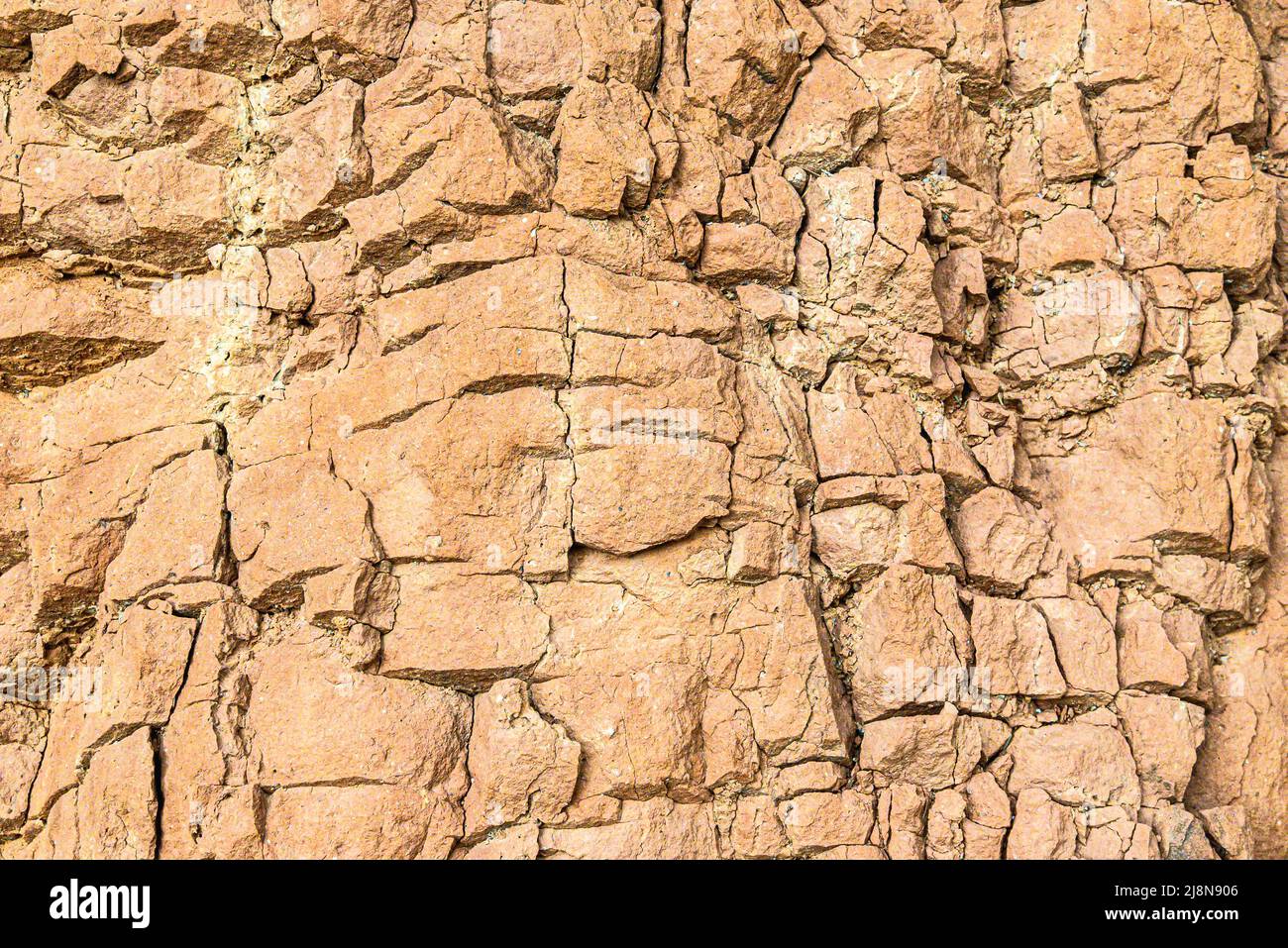 Mountain cracked earth wall background. texture, nature Stock Photo