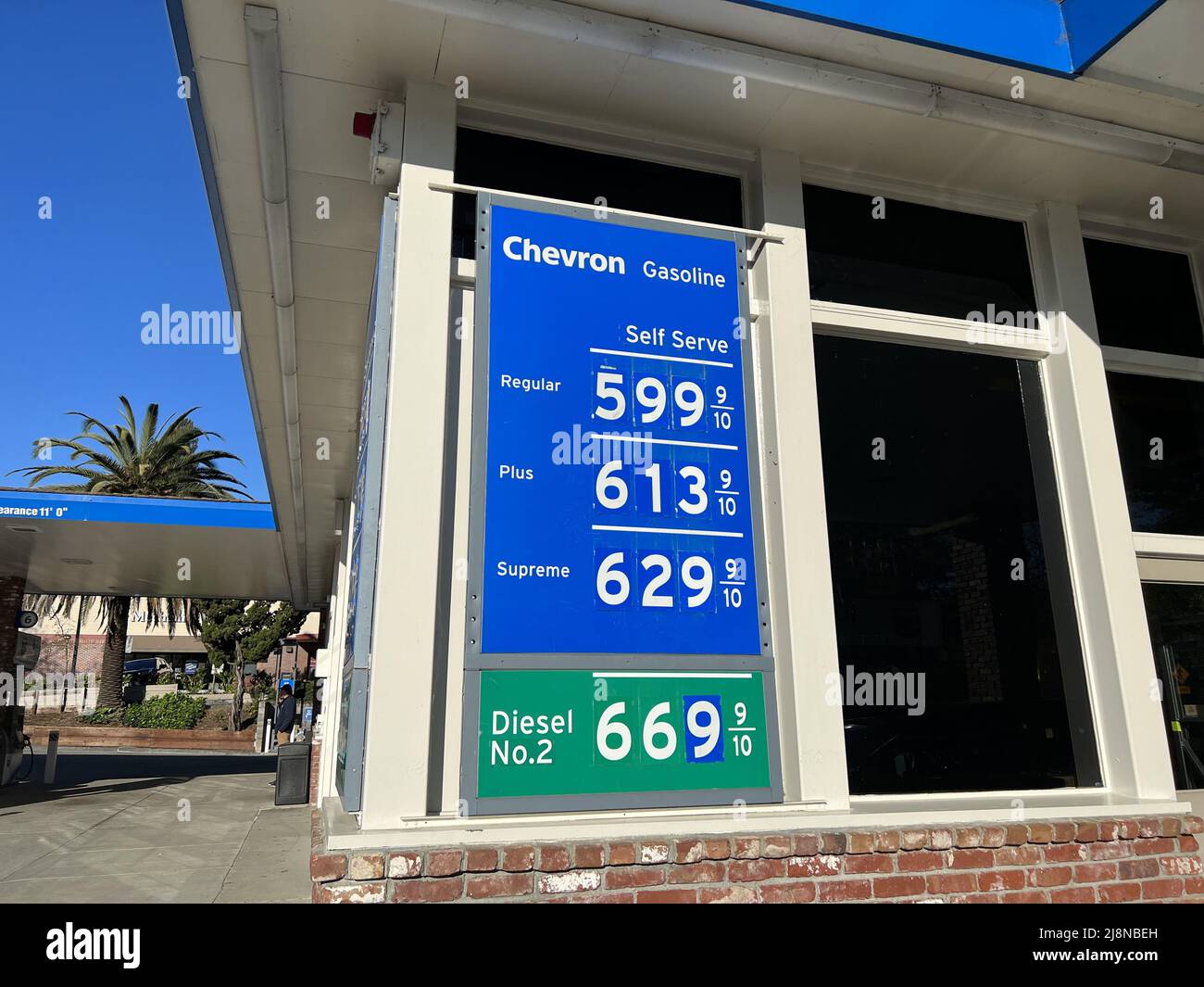 Chevron gas station with display showing high gas prices, Lafayette
