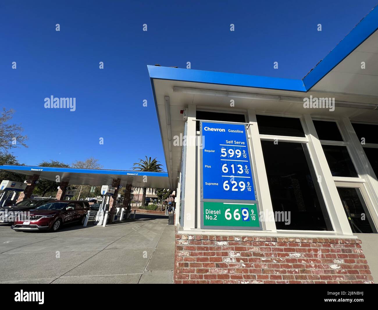 Chevron gas station with display showing high gas prices, Lafayette