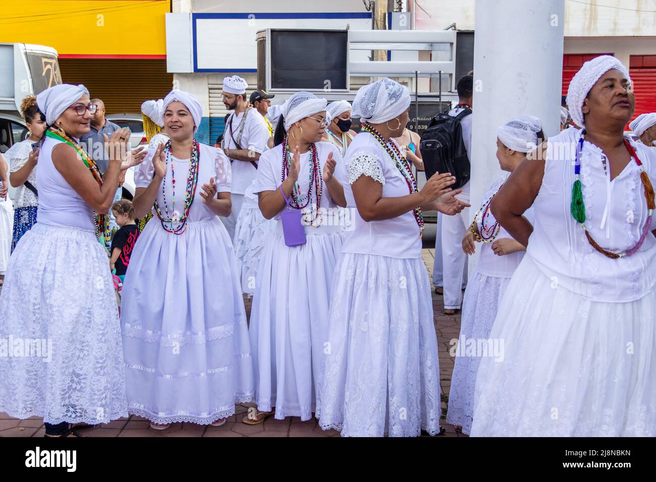 Aparecida de Goiania, Goiás, Brazil – May 15, 2022: The baianas in traditional white clothes. Some people gathered for the Procession of Old Blacks. Stock Photo