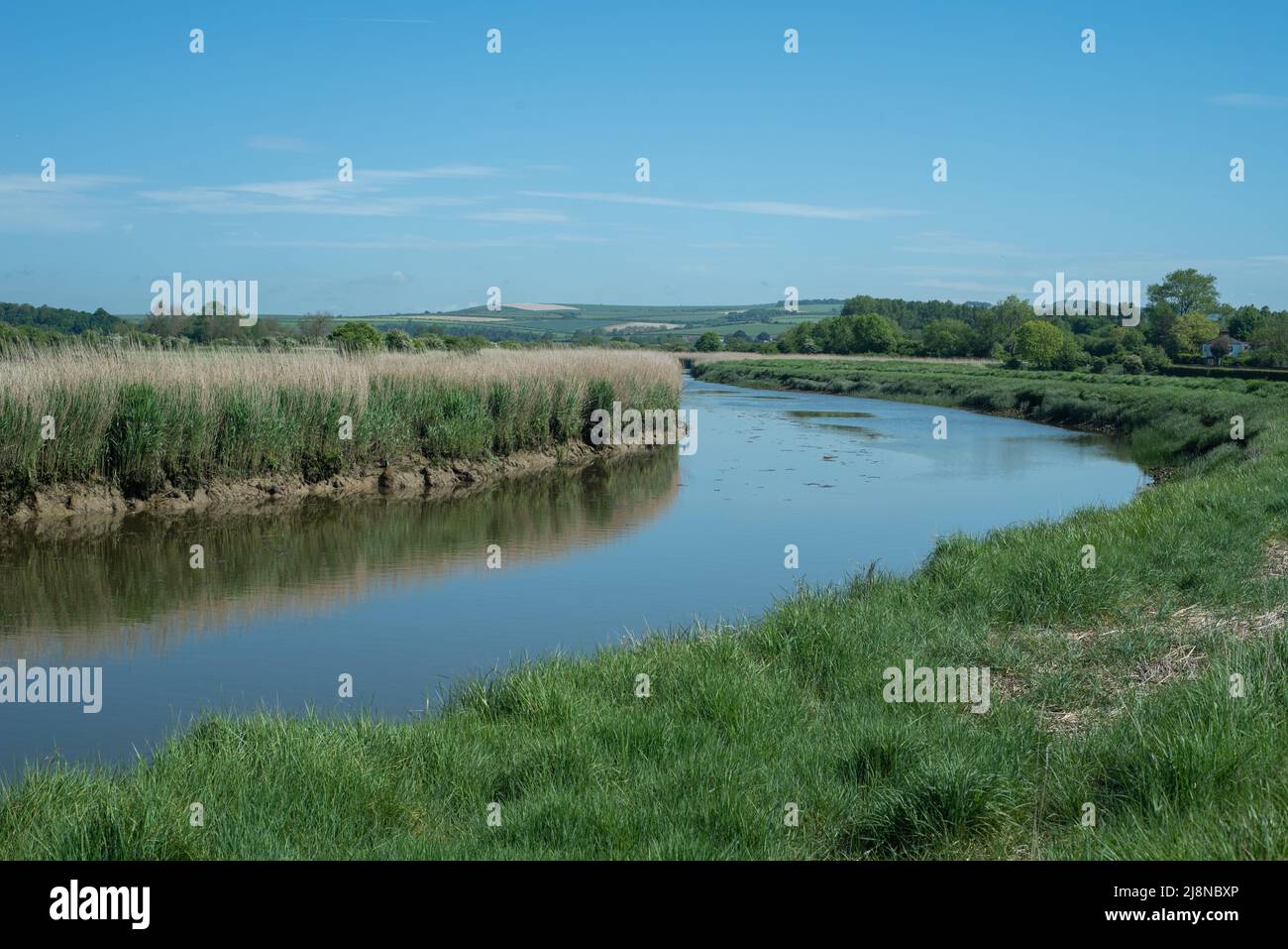Beautiful picturesque scenery of a path leading around the River Arun in West Sussex, England. Part of the South Downs scenic area. Stock Photo