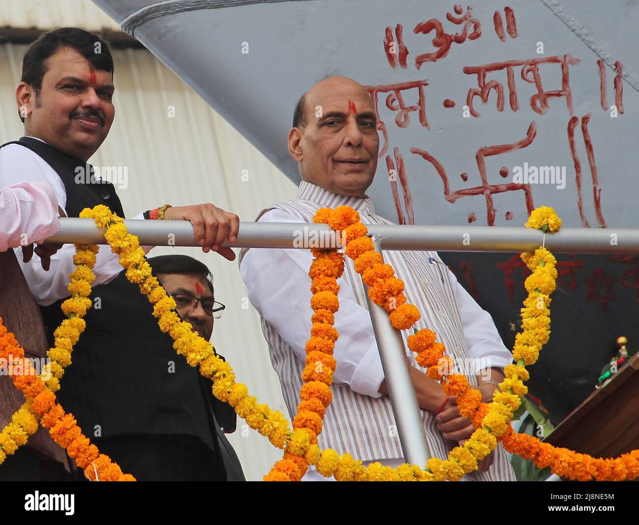 Mumbai, India. 17th May, 2022. L-R Bharatiya Janata Party (BJP) Leader of Opposition in Maharashtra Legislative Assembly, Devendra Fadnavis and Indian Defence Minister Rajnath Singh are seen at the launch of second advanced stealth frigate warship of P17A class at Mazagon Dock Shipbuilders Limited (MDL) in Mumbai. The warship 'Udaygiri' was launched by Indian Defence Minister Rajnath Singh who was the chief guest at the event. Credit: SOPA Images Limited/Alamy Live News Stock Photo