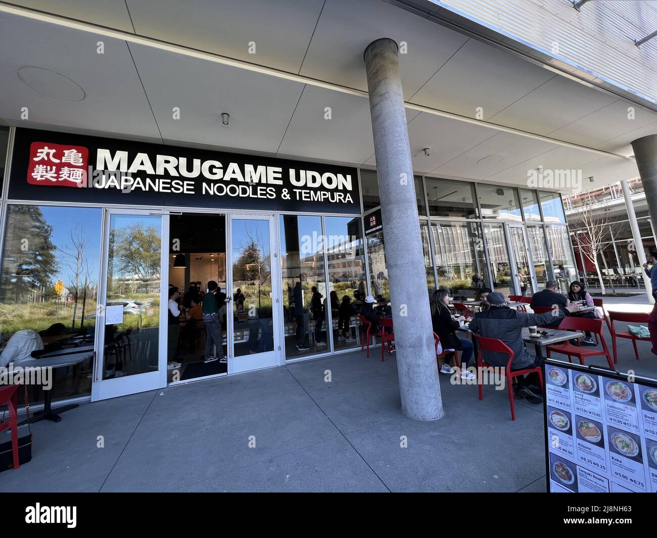 USA. 09th Mar, 2022. Facade with people dining outdoors during grand