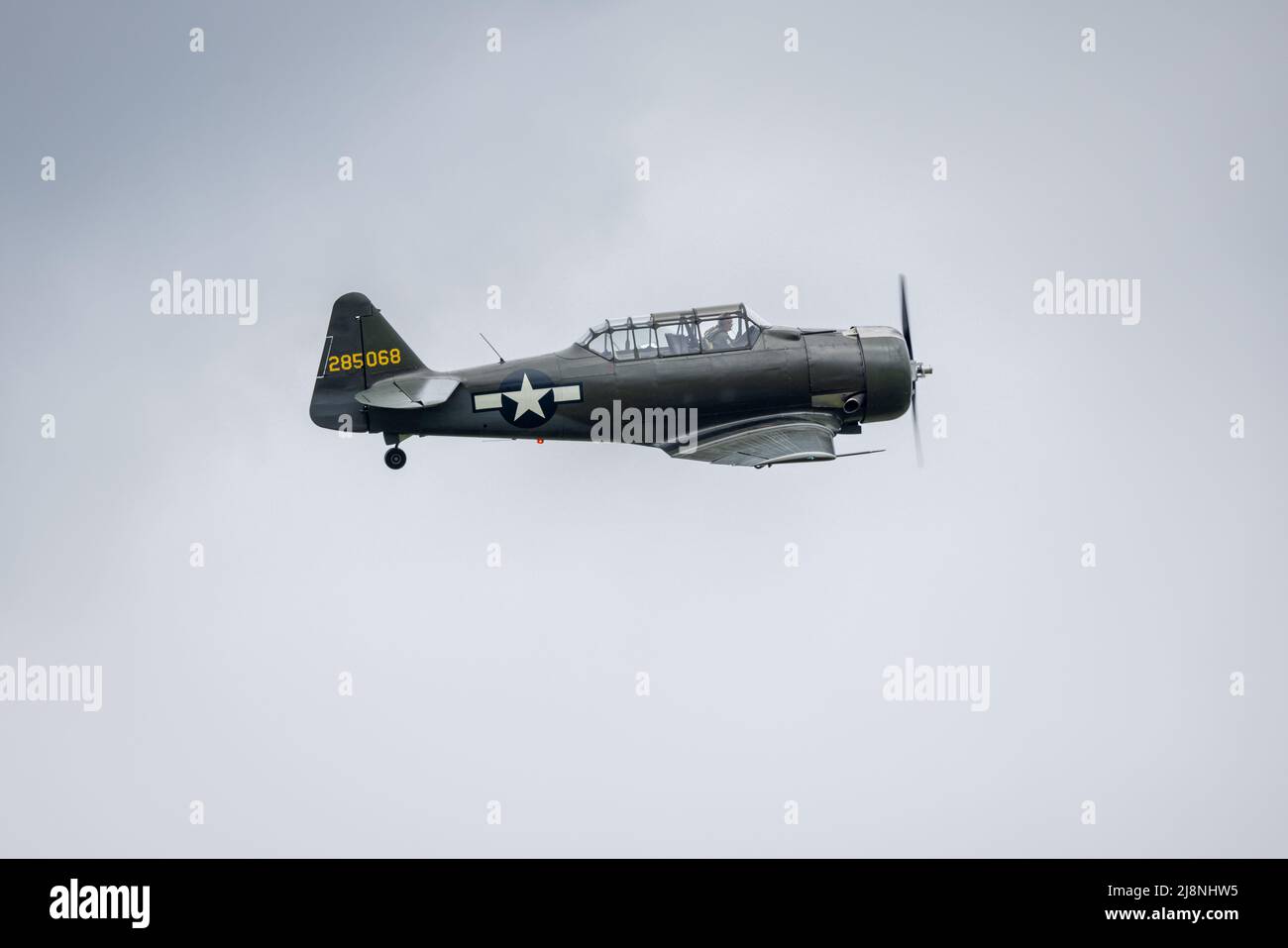 North American AT-6 Texan in the United States Army Air Corps markings airborne at the Shuttleworth Season Premiere airshow on the 1st May 2022 Stock Photo