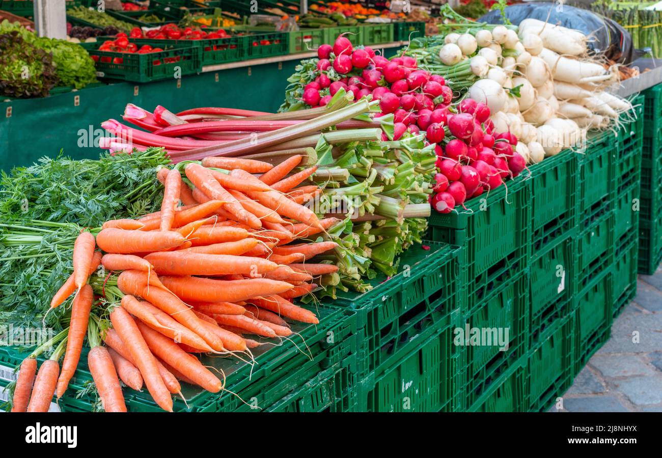 Fresh vegetables and fruit at a farmers market. Selective focus on the carrots. Stock Photo