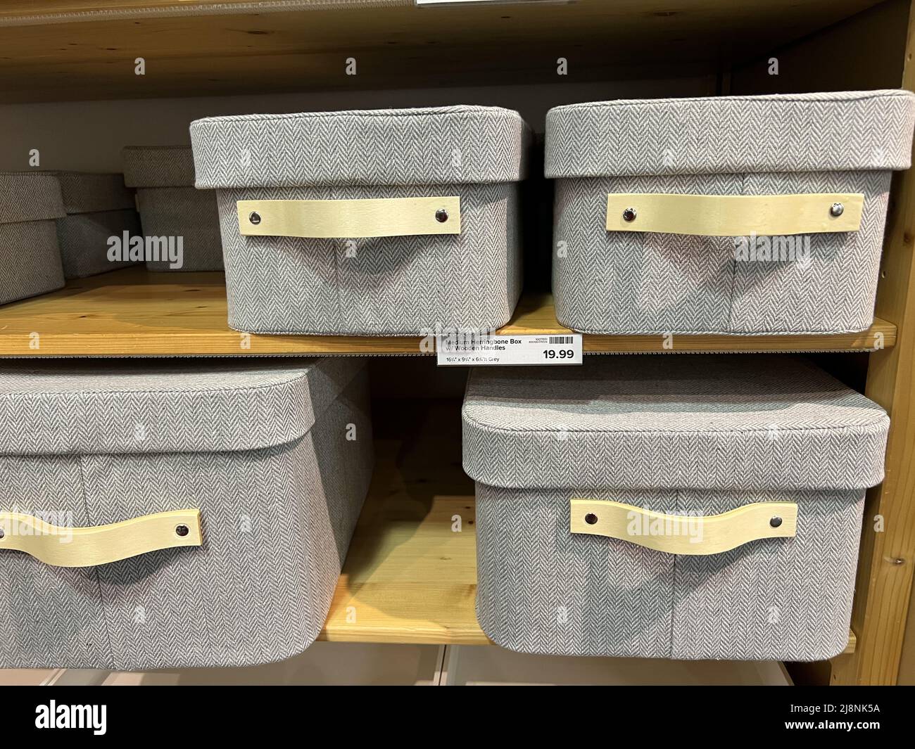 Storage containers are visible on shelves at the Container Store