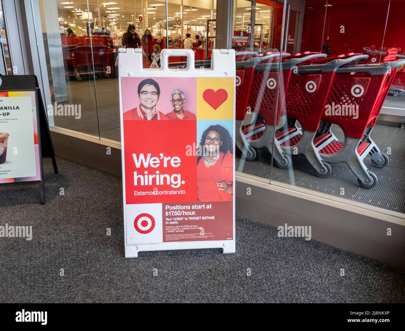 Lynnwood, WA USA - circa April 2022: Angled view of a Now Hiring sign inside a Target retail and grocery store. Stock Photo