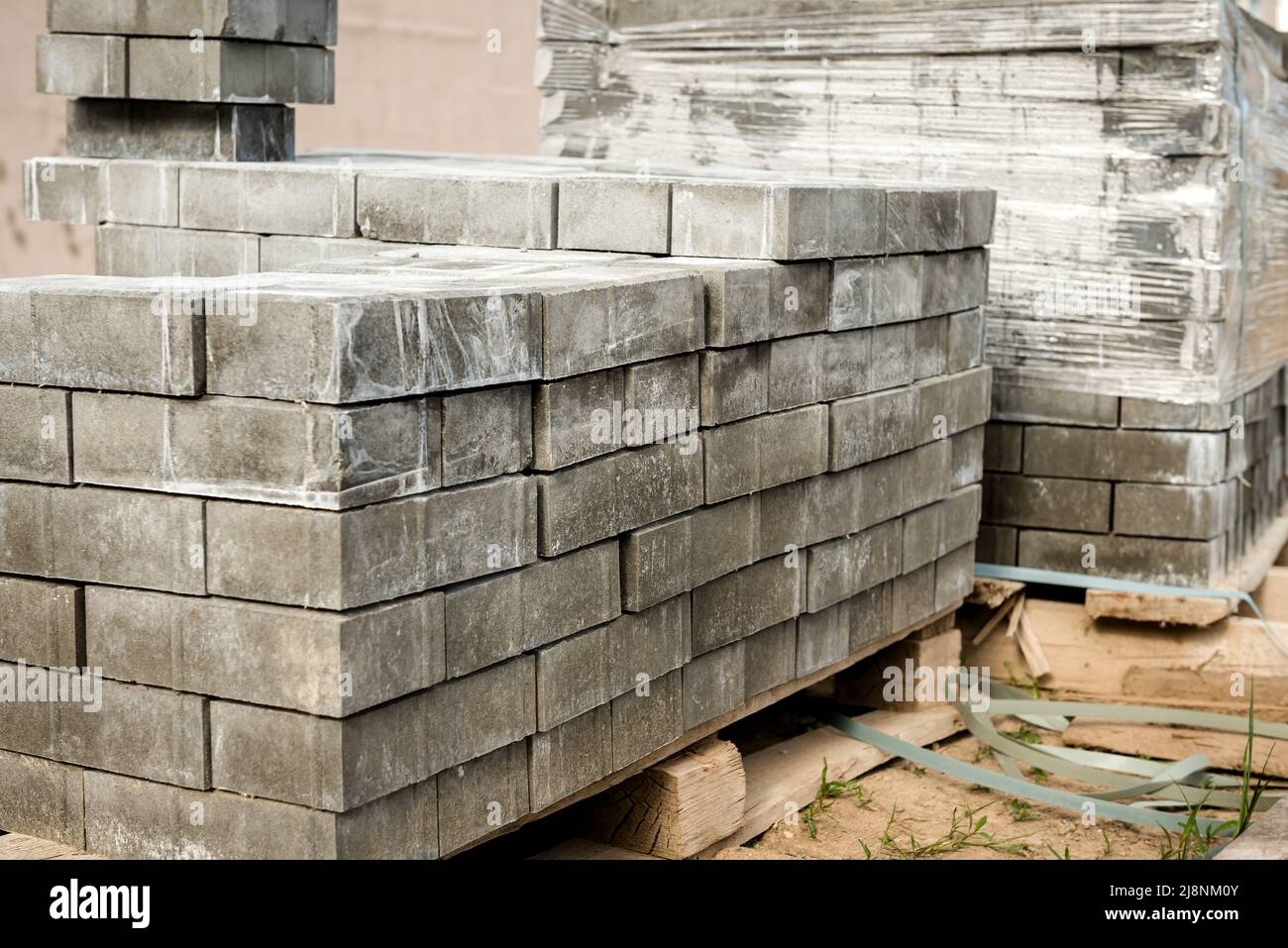 Laying the path with paving bricks. Street improvement. Construction of pedestrian roads Stock Photo