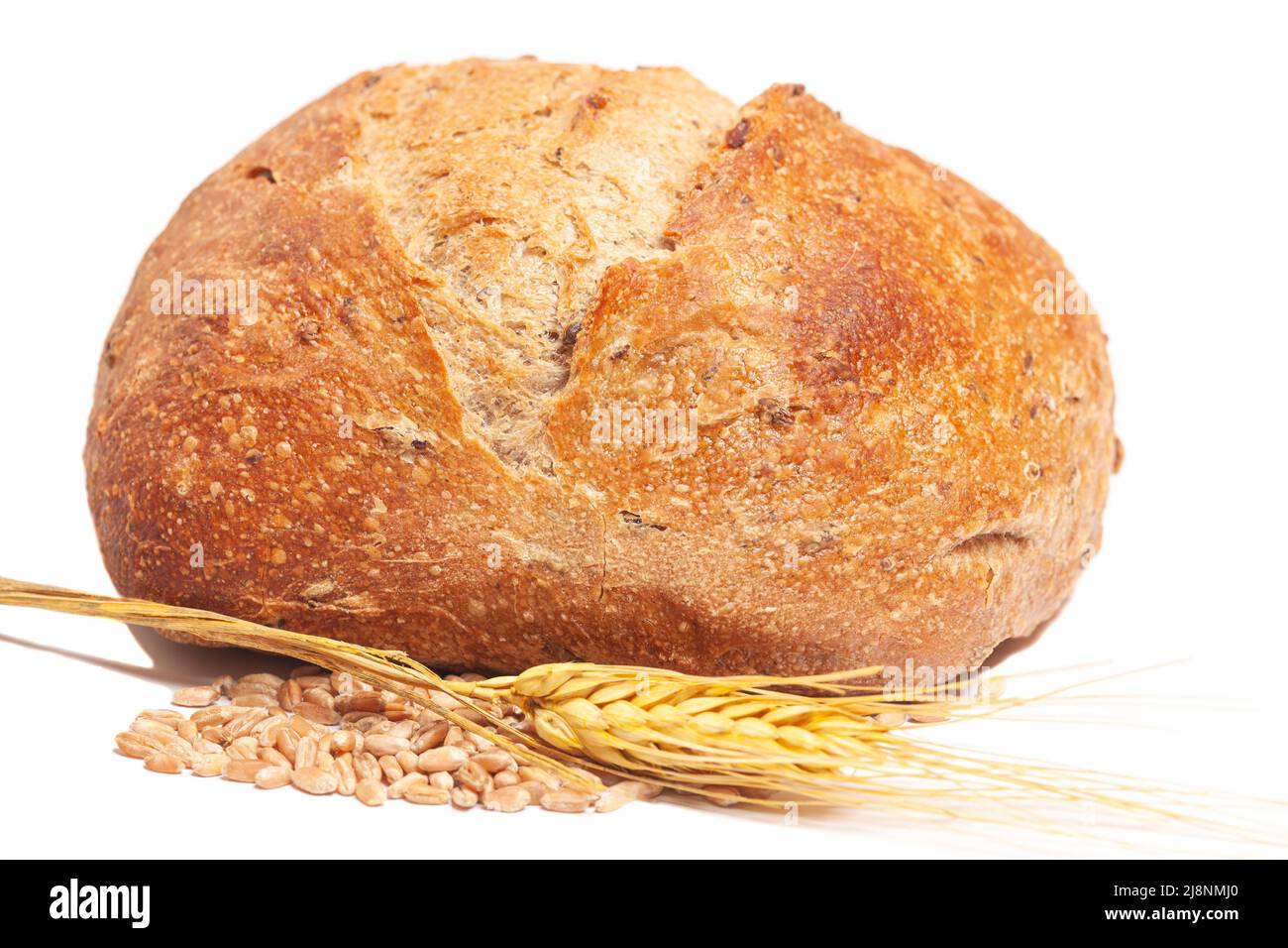 Loaf of round bread with wheat ears isolated on white background Stock ...