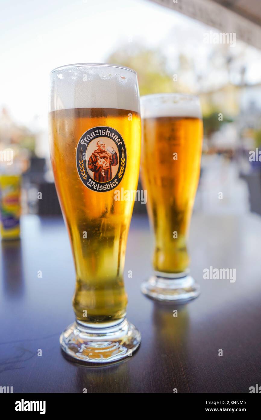 Two glasses of beer with, Franziskaner Weissbier on table. Stock Photo