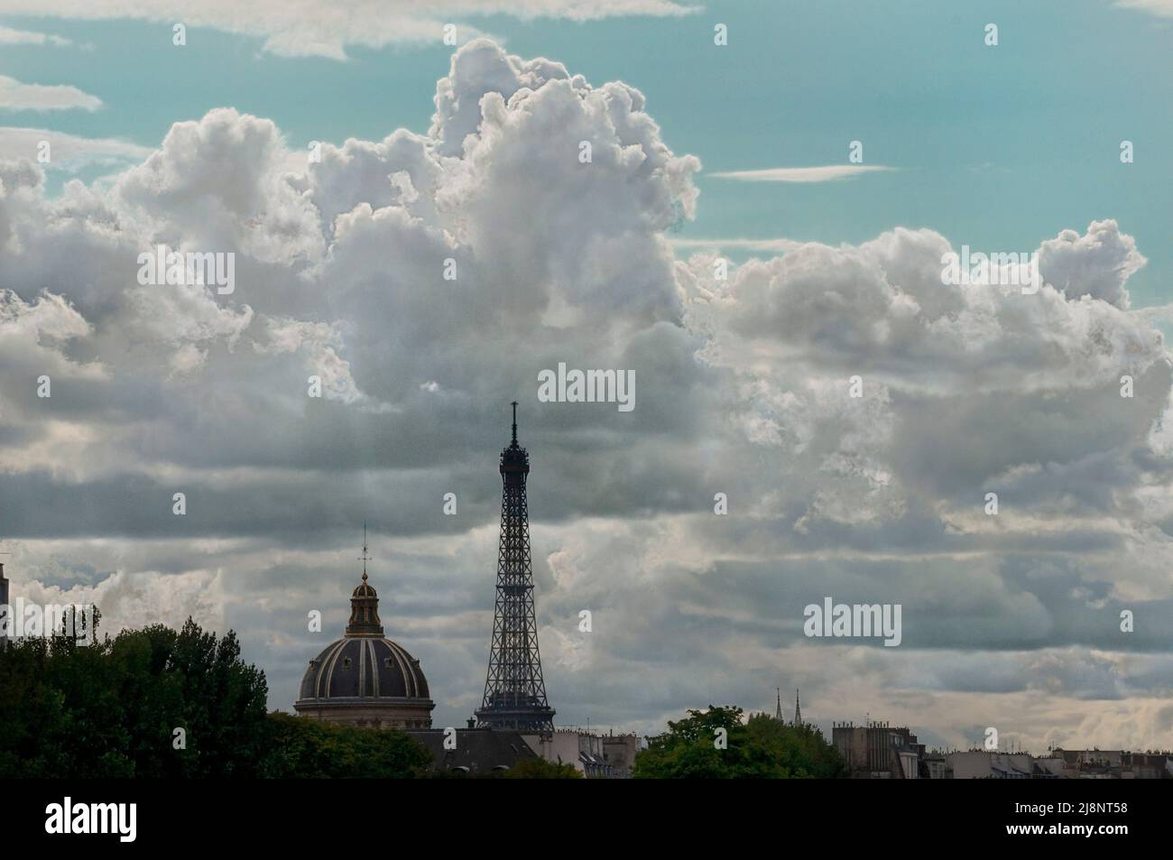 Summertime clouds behind l’Institut de France and Eiffel Tower on the