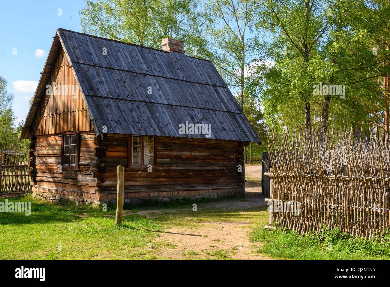 Wdzydze Kiszewskie, Poland - May 15, 2022: Wooden cottage in Kashubian Ethnographic Park in Wdzydze Kiszewskie Stock Photo