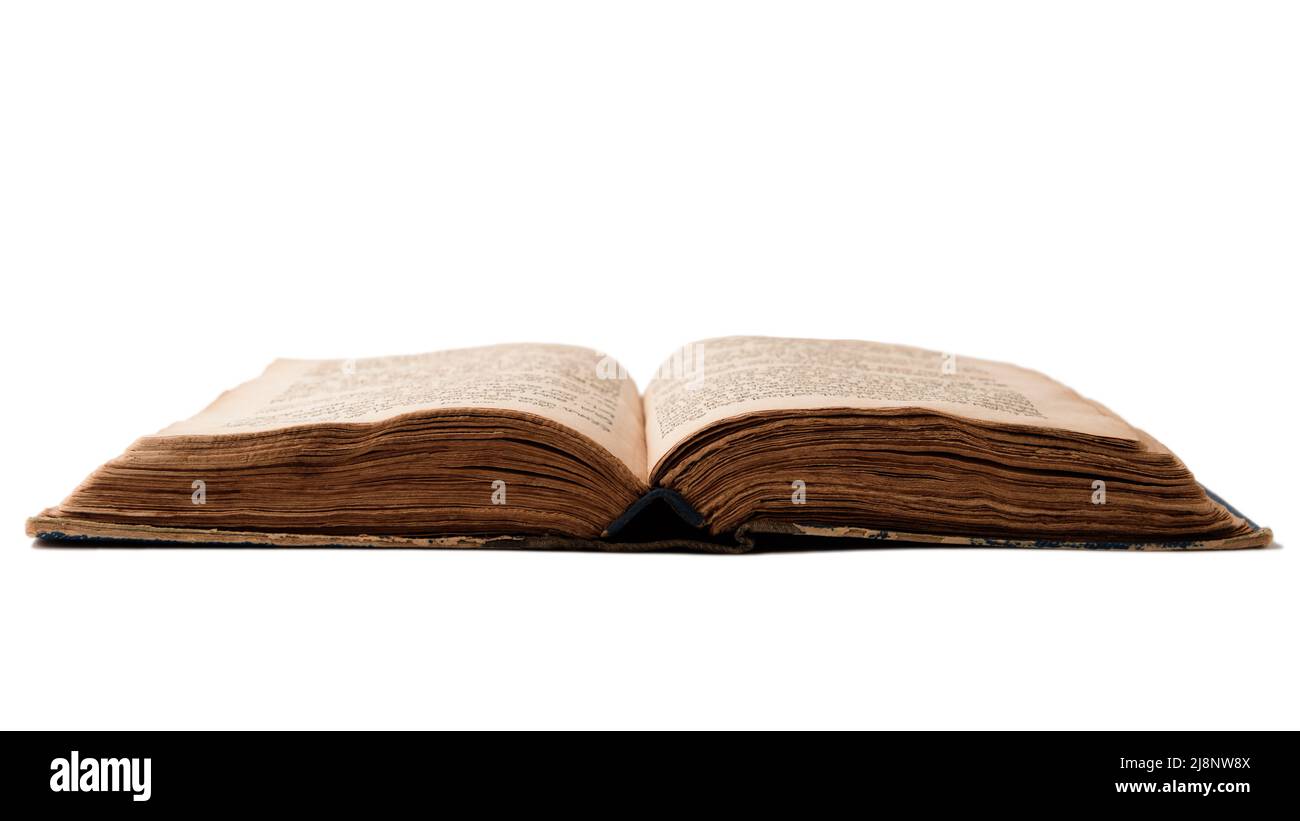 Single old worn jewish book. Open pages of Torah isolated on white background. Closeup. Selective focus Stock Photo