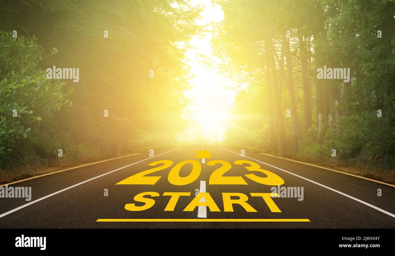 The word 2023 written on forest road. Concept for new year 2023. The route to the new year indicated by the arrow. Anniversary planning concept Stock Photo