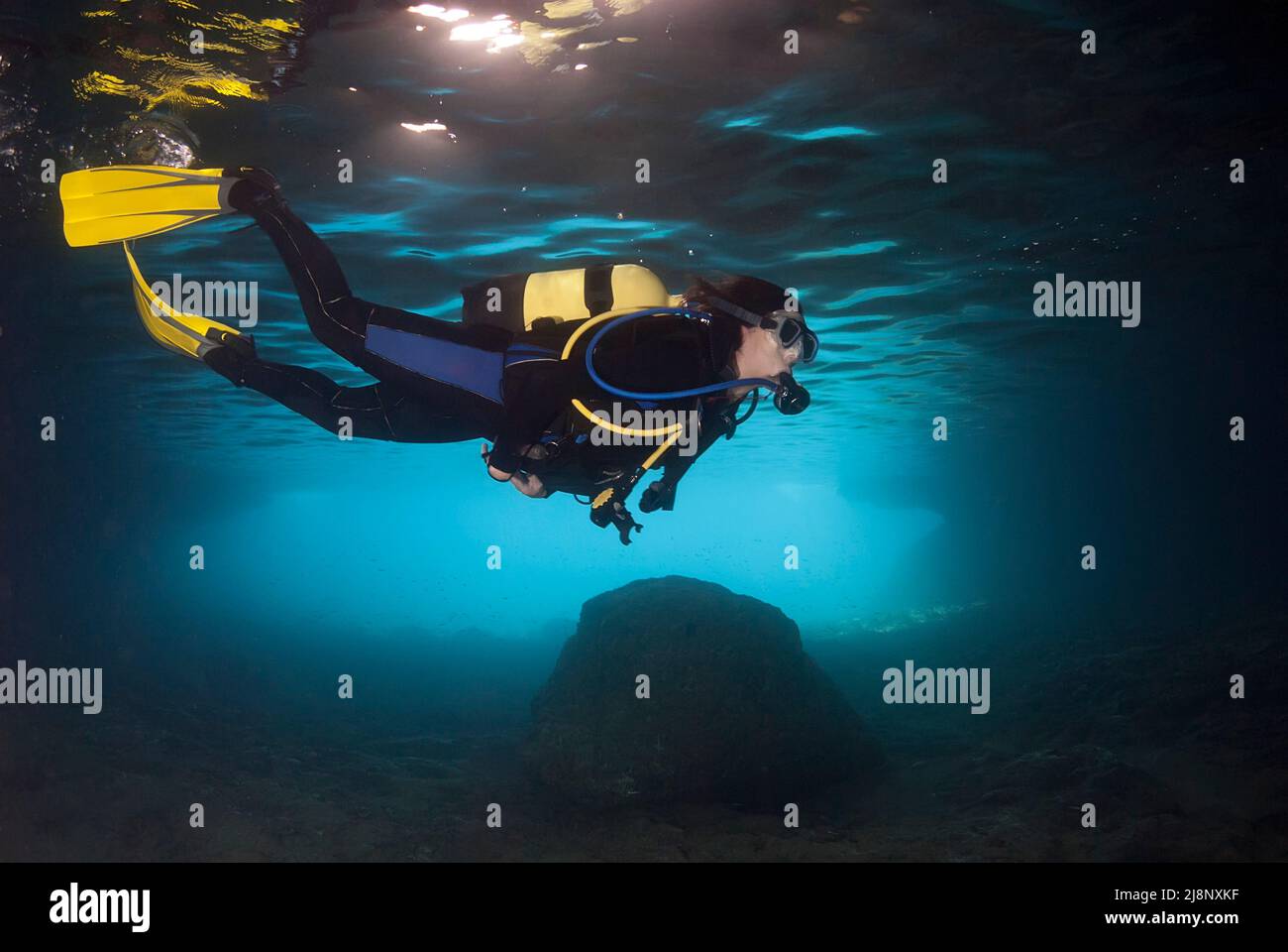 Diver exploring an underwater cavern in the Mediterranean Stock Photo