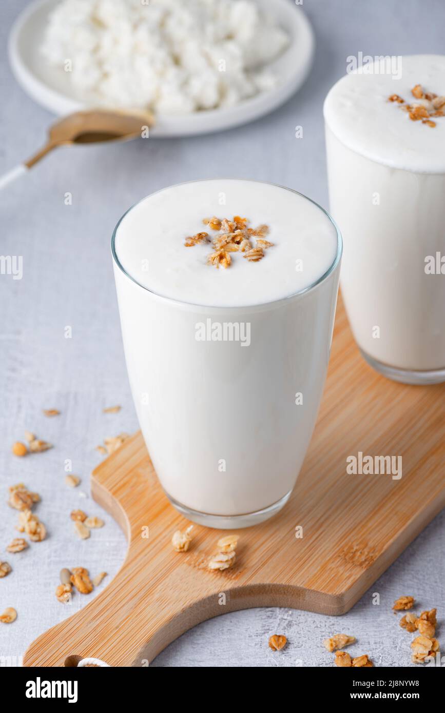 Kefir, buttermilk or yogurt, cottage cheese with granola Stock Photo
