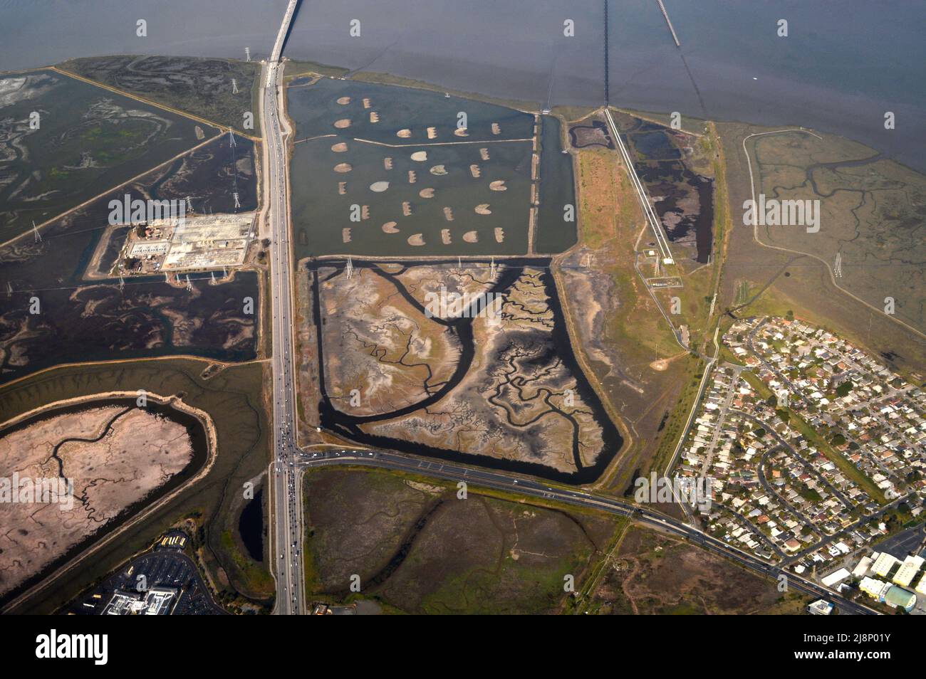 Salt marshes along San Francisco Bay in California as seen from a passenger plane landing at nearby San Francisco International Airport. Stock Photo