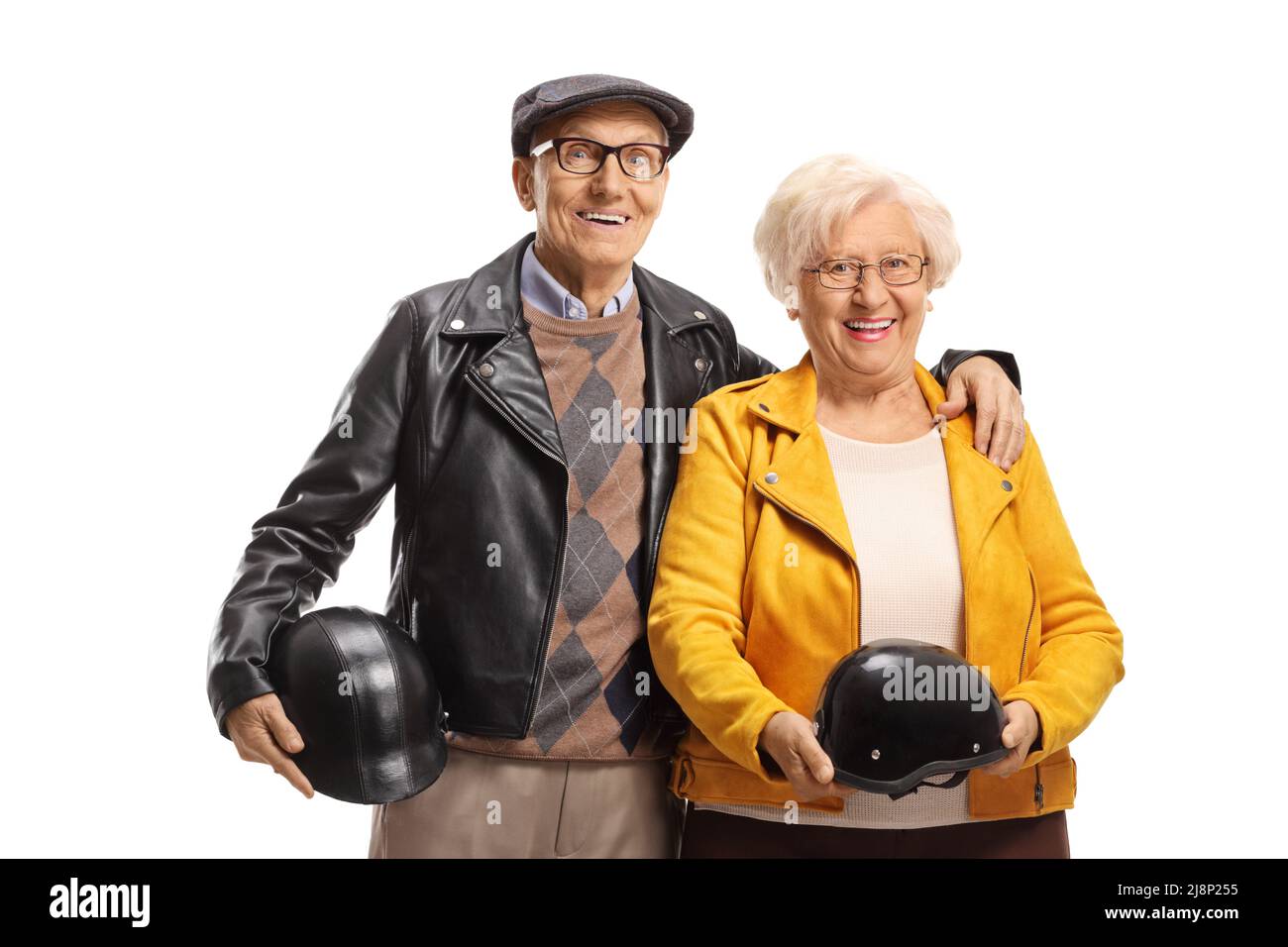Elderly man and woman standing and holding motorbike helmets isolated on white background Stock Photo
