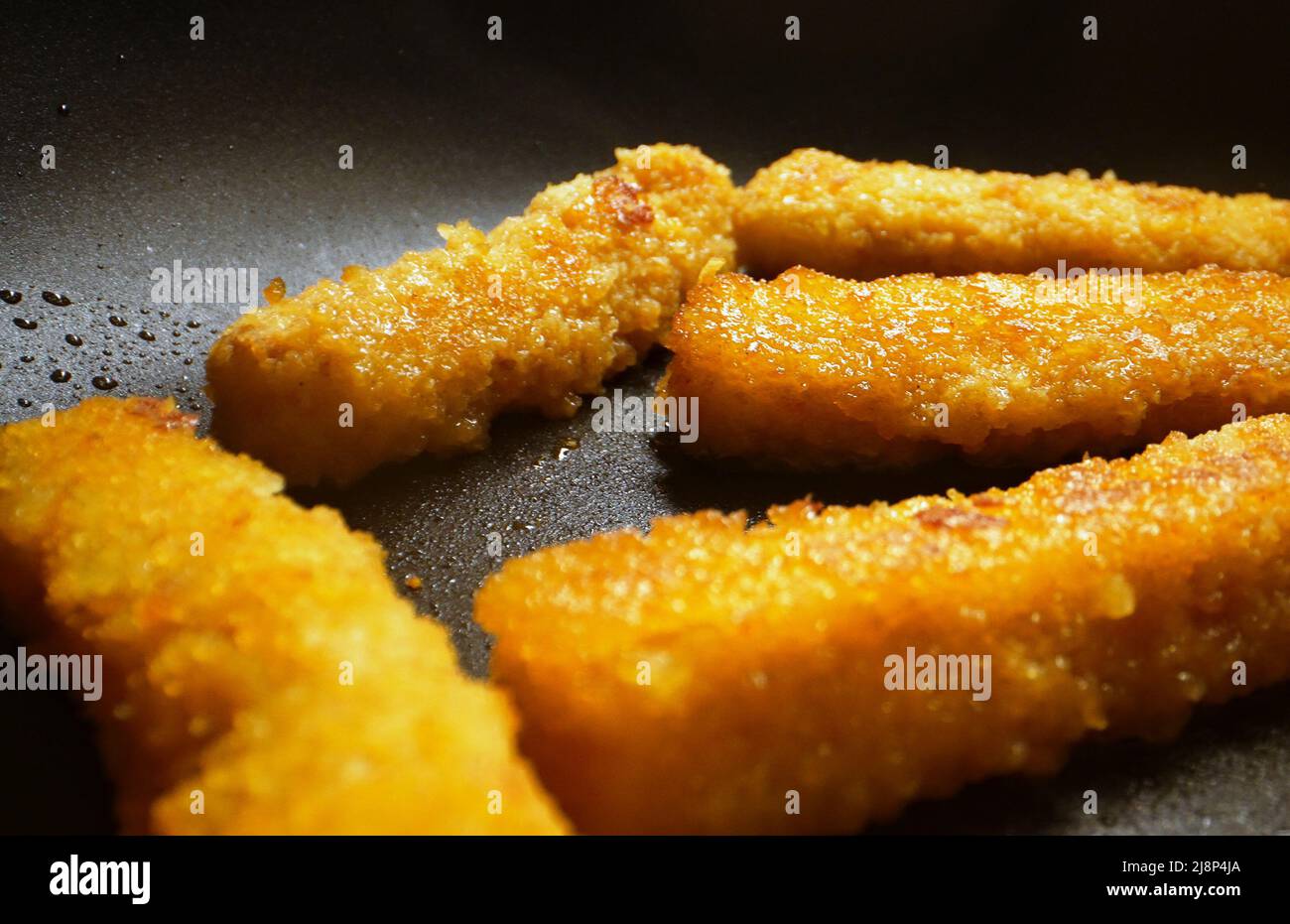 Chicken nuggets frying in a pan Stock Photo Alamy