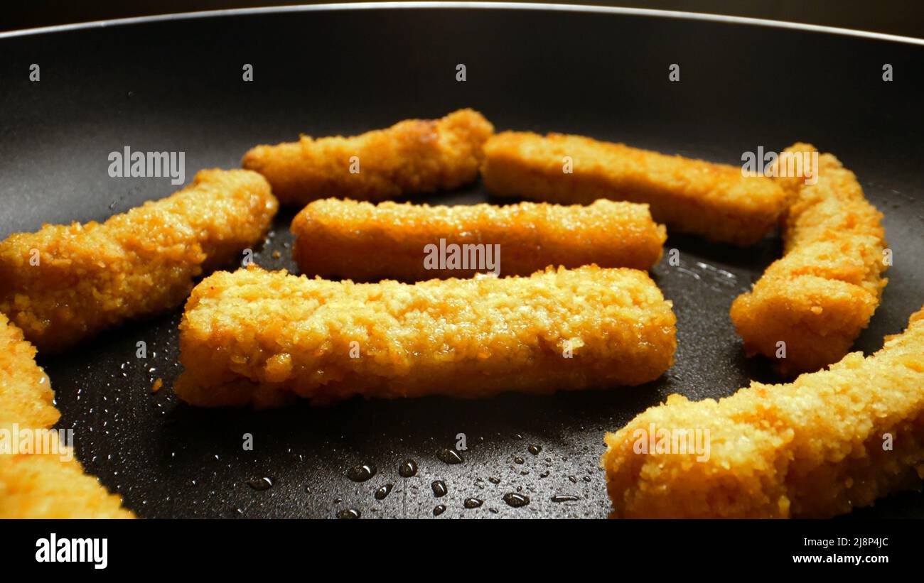 Chicken nuggets frying in a pan Stock Photo Alamy
