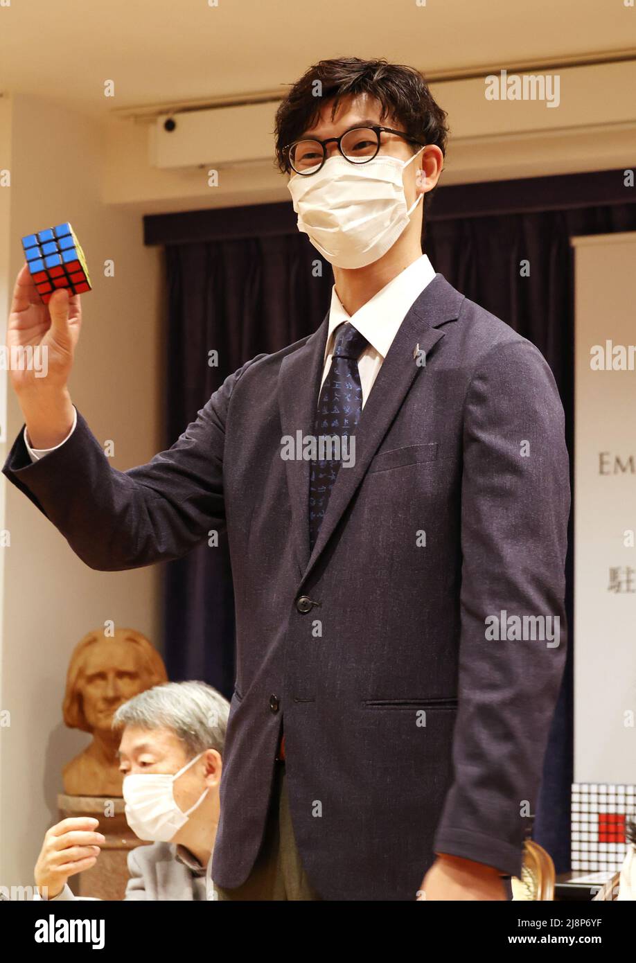 Tokyo, Japan. 17th May, 2022. Former world champion of the World Rubik's Cube Championship Shuhei Omura demonstrates a party to celebrate the publication of Japanese version of Erno Rubik's autobiography at the Hungarian embassy in Japan in Tokyo on Tuesday, May 17, 2022. Hungarian architect Erno Rubik developed a cubic mechanical puzzle 'Rubik's Cube' in 1974. Credit: Yoshio Tsunoda/AFLO/Alamy Live News Stock Photo