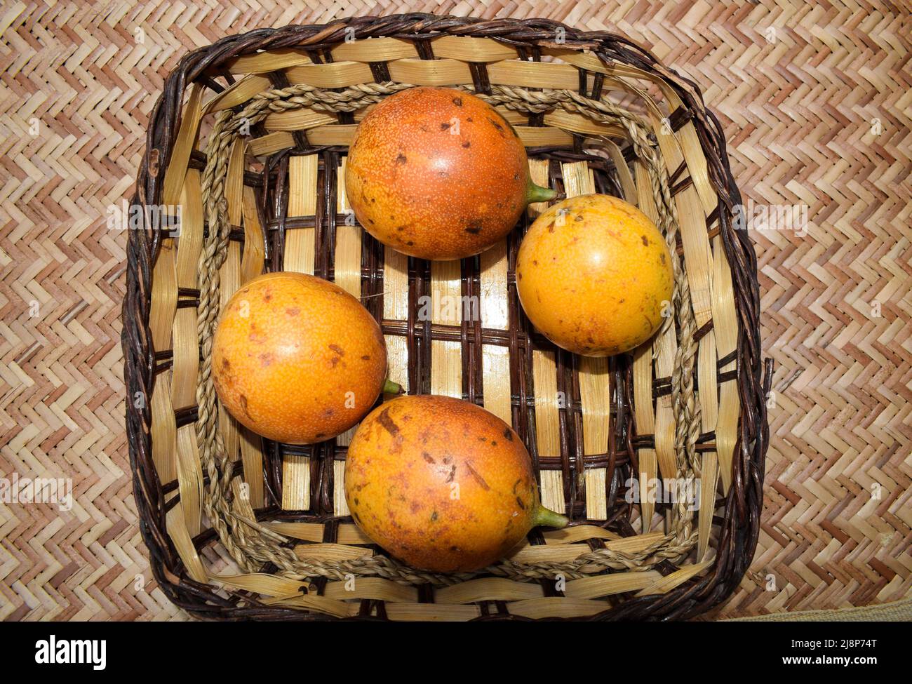 Passionfruits in wicker basket. yellow Passionfruit. Delicious passion fruits in basket Passionfruit Stock Photo