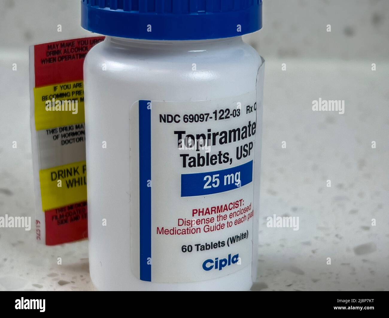 Seattle, WA USA - circa May 2022: Close up view of an angled bottle of Topiramate medication. Stock Photo