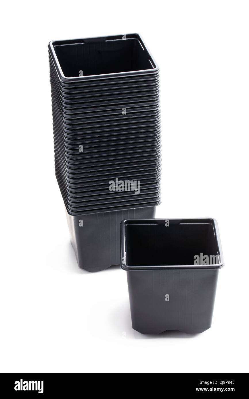 Stack  of black plastic pots isolated on white background Stock Photo