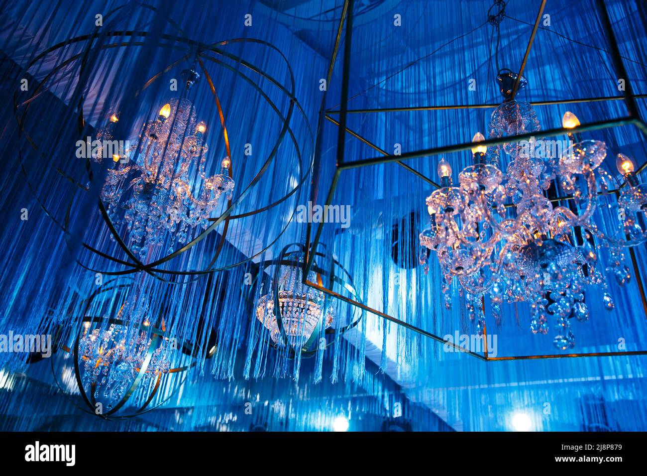 Vintage crystal chandeliers at a wedding party Stock Photo Alamy
