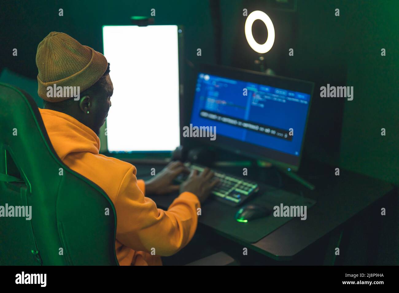 Afro man programming website firewall with codes on computer medium shot indoors IT concept. High quality photo Stock Photo