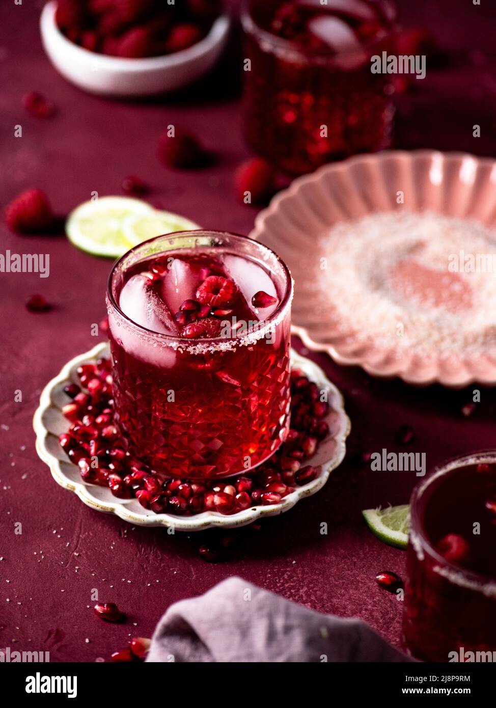 Pomegranate Margarita with Pink Salt and Limes Stock Photo