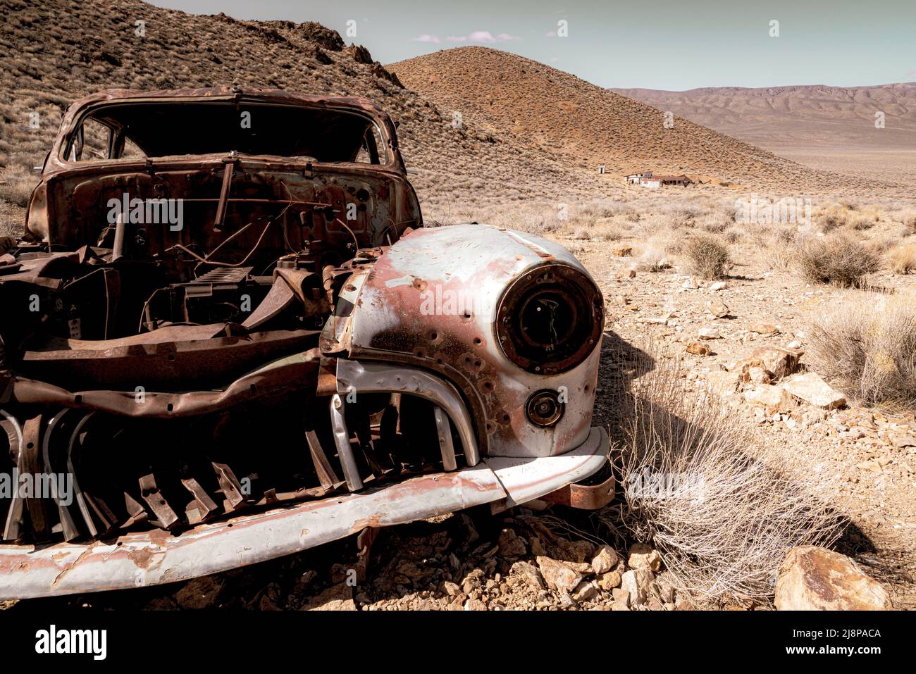 Old rusty abandoned vintage antique car in the desert Stock Photo