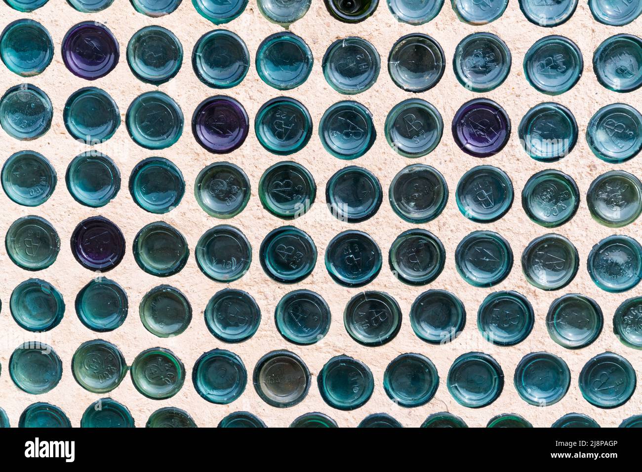 Rhyolite, NV,  - March 4, 2022 : Wall of the unique house constructed of bottles by Tom Kelly in 1906 in the mining town of Rhyolite, Nevada Stock Photo