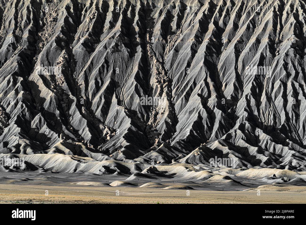 Textured detail of the Based of eroded Butte in the Caineville Badlands of Utah Stock Photo